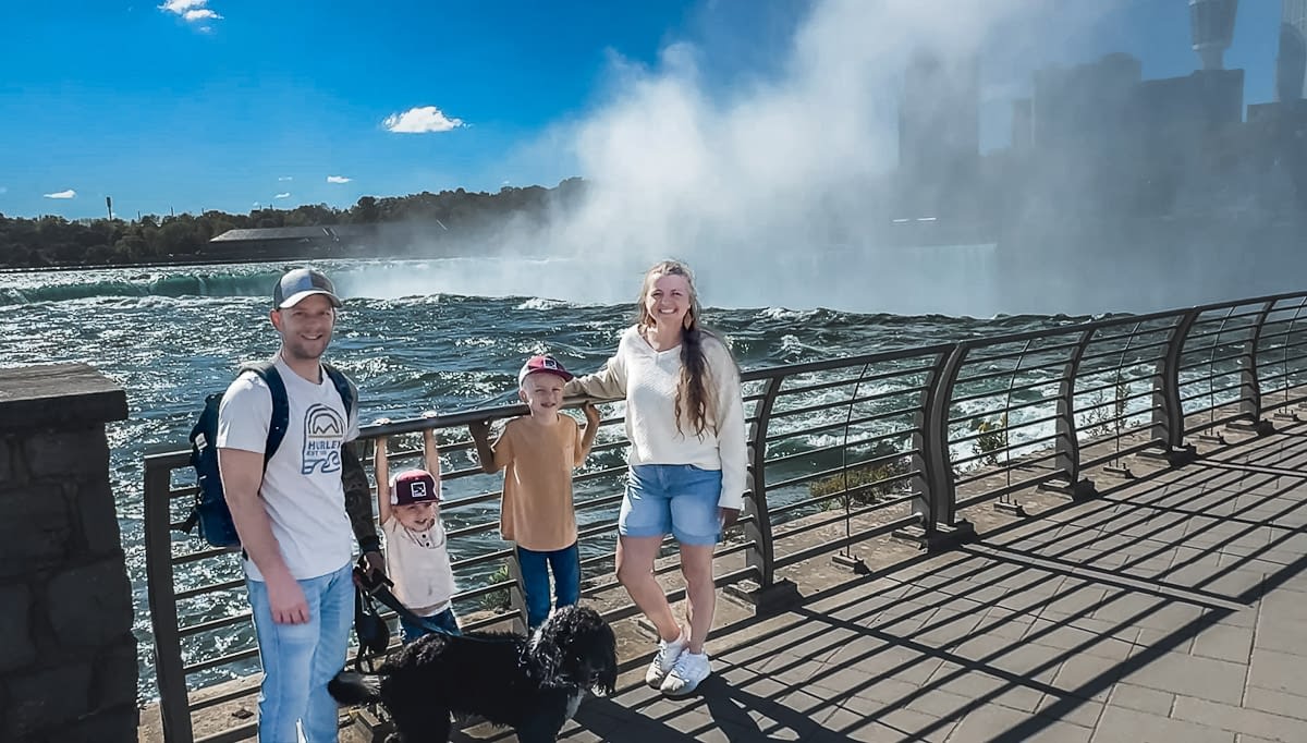 Family takes a photo at Terrapin Point at Niagara Falls State Park.